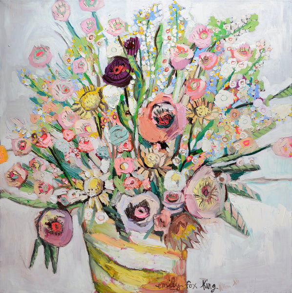 A glorious profession of pink, lavender, light blues, soft yellow flowers in a yellow and white striped pot by Emily Fox King.